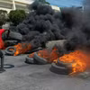Người biểu tình gây bạo loạn tại Port-au-Prince, Haiti sau quyết định từ chức của Thủ tướng Ariel Henry, ngày 12/3. (Ảnh: AFP/TTXVN)