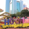 Linh vật Rồng ở cổng kết gắn với biểu tượng Thành phố mang tên Bác. (Ảnh: Mỹ Phương/TTXVN)