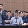 Luật sư bào chữa tham gia tranh luận với đại diện Viện Kiểm sát giữ quyền công tố tại phiên tòa. (Ảnh: TTXVN)