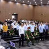 Các bị cáo tại phiên toà xét xử. (Ảnh: Phạm Kiên/TTXVN)
