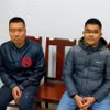 Hai đối tượng bị triệu tập làm việc tại cơ quan công an. (Ảnh: TTXVN phát)