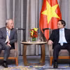 Thủ tướng Phạm Minh Chính tiếp ông Nghiêm Giới Hòa, Nhà sáng lập Tập đoàn Xây dựng Thái Bình Dương. (Ảnh: Dương Giang/TTXVN)