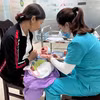 Tiêm phòng vaccine phòng, chống bệnh ho gà. (Ảnh: Thùy Dung/TTXVN)
