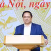Thủ tướng Phạm Minh Chính chủ trì Hội nghị sơ kết 6 tháng Ủy ban Quốc gia về chuyển đổi số và Đề án 06. (Ảnh: Dương Giang/TTXVN)