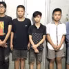 Các đối tượng gây án tại cơ quan Công an. (Ảnh: TTXVN phát)