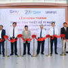 Các đại biểu thực hiện nghi thức khánh thành Trung tâm Thiết kế vi mạch (SCDC). (Ảnh: Tiến Lực/TTXVN)