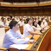 Chiều nay, Quốc hội đã chính thức Thông qua dự thảo Nghị quyết về phê chuẩn quyết toán ngân sách nhà nước 2022. (Ảnh: TTXVN)