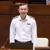 Tổng Kiểm toán Nhà nước Ngô Văn Tuấn trả lời chất vấn đại biểu Quốc hội về trách nhiệm kiểm toán các đại án thời gian qua. (Ảnh: TTXVN)