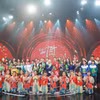 Các em nhỏ và khách mời tham gia Gala "Cặp lá yêu thương." (Ảnh: CTV/Vietnam+)