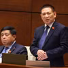 Bộ trưởng Bộ Tài chính Hồ Đức Phớc phát biểu giải trình, làm rõ một số vấn đề đại biểu Quốc hội nêu. (Ảnh: Văn Điệp/TTXVN)
