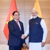 Thủ tướng Phạm Minh Chính gặp Thủ tướng Ấn Độ Narendra Modi tại Hội nghị thượng đỉnh Nhóm Các nước Công nghiệp Phát triển (G7) Mở rộng ở Hiroshima (Nhật Bản), ngày 20/5/2023. (Ảnh: Dương Giang/TTXVN)