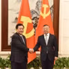 Trong khuôn khổ Hội thảo Lý luận lần thứ 19 giữa hai Đảng, ông Nguyễn Xuân Thắng (trái) đã hội đàm với ông Lý Thư Lỗi, Ủy viên Bộ Chính trị, Bí thư Ban Bí thư, Trưởng Ban Tuyên truyền Trung ương Đảng Cộng sản Trung Quốc. (Ảnh: Công Tuyên/TTXVN)