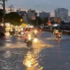 Nước ngập trên đường Trần Xuân Soạn, Quận 7, Thành phố Hồ Chí Minh. (Ảnh: Hồng Giang/TTXVN)