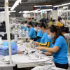Ông Cao Hữu Hiếu, Tổng Giám đốc Vinatex phát biểu tại hội nghị tổng kết của Tập đoàn. (Ảnh: Xuân Quảng/Vietnam+)