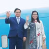 Thủ tướng Phạm Minh Chính và Phu nhân. (Ảnh: Dương Giang/TTXVN)