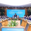 Quang cảnh buổi thăm và làm việc của Đoàn đại biểu cấp cao Thanh tra Nhà nước Lào tại BIDV. (Ảnh: Văn Điệp/TTXVN)