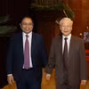 Tổng Bí thư Nguyễn Phú Trọng, Thủ tướng Chính phủ Phạm Minh Chính dự Hội nghị toàn quốc quán triệt và triển khai Nghị quyết 11-NQ/TW ngày 10/2/2022 của Bộ Chính trị. (Ảnh: Trí Dũng/TTXVN)