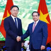Thủ tướng Phạm Minh Chính tiếp ông Lưu Ninh, Bí thư Đảng ủy Khu tự trị dân tộc Choang Quảng Tây, Trung Quốc. (Ảnh: Dương Giang/TTXVN)