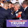 Ông Donald Trump được các mật vụ vây quanh đưa khỏi sân khấu sau khi bị bắn. (Nguồn: Reuters)