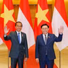Chủ tịch Quốc hội Vương Đình Huệ với Tổng thống Indonesia Joko Widodo. (Ảnh: Nhan Sáng/TTXVN)