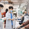 Bảo vệ, chăm sóc và nâng cao sức khỏe nhân dân là nhiệm vụ chính trị hàng đầu. (Ảnh: Minh Quyết/TTXVN). 