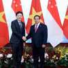 Thủ tướng Phạm Minh Chính và Thủ tướng Singapore Lawrence Wong. 