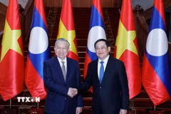 Tổng Bí thư Tô Lâm hội kiến Thủ tướng Chính phủ Lào Sonexay Siphandone. (Ảnh: Thống Nhất/TTXVN)
