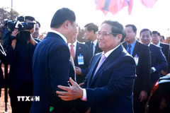 Thủ tướng Phạm Minh Chính và Thủ tướng Lào Sonexay Siphandone dự Lễ động thổ dự án Công viên Hữu nghị Lào-Việt Nam. (Ảnh: Dương Giang/TTXVN)