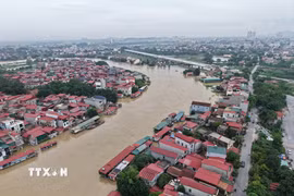 Nước sông Cầu dâng cao ngập nhà dân gần 2m, ngày 25/8/2026. (Ảnh: Thanh Thương/TTXVN)