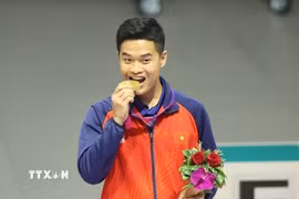 Thể thao Việt Nam có Huy chương vàng đầu tiên ở ASIAD 19 của xạ thủ Phạm Quang Huy ở nội dung súng ngắn hơi 10m cá nhân nam. (Ảnh: TTXVN phát)