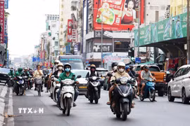 Tài xế công nghệ tại thành phố Hồ Chí Minh. (Ảnh: Hồng Đạt/TTXVN)