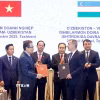 Chủ tịch Quốc hội Trần Thanh Mẫn chứng kiến Lễ trao các Thỏa thuận hợp tác. (Ảnh: Doãn Tấn/TTXVN)