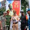 Các lực lượng họp bàn triển khai phương án đảm bảo An ninh trật tự, an toàn giao thông cho Lễ tổng hợp luyện lần 1. (Ảnh: Phạm Kiên/TTXVN)