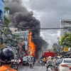 Vụ cháy cửa hàng điện thoại trên đường Xô Viết Nghệ Tĩnh, phường Ninh Kiều, thành phố Cần Thơ sáng 10/7. (Ảnh: TTXVN phát)