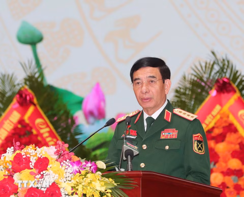 Đại tướng Phan Văn Giang, Ủy viên Bộ Chính trị, Phó Bí thư Quân ủy Trung ương, Bộ trưởng Bộ Quốc phòng trình bày Báo cáo Chính trị. (Ảnh: Trọng Đức/TTXVN)