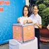 Cán bộ, công chức cơ quan Ủy ban Mặt trận Tổ quốc Việt Nam Thành phố Hồ Chí Minh ủng hộ Quỹ “Vì biển đảo quê hương-Vì tuyến đầu Tổ quốc” sáng 3/8. (Ảnh: Báo Nhân dân)
