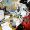 Kiên quyết cưỡng chế, xử lý thu hồi nợ đối với các doanh nghiệp "chây ỳ". (Ảnh minh họa: TTXVN)