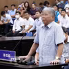 Bị cáo Lê Thanh Thản tại phiên xét xử năm 2023. (Ảnh: Phạm Kiên/TTXVN)