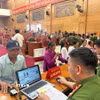 Lực lượng Công an tỉnh Phú Thọ thực hiện sinh trắc học đối với thân nhân liệt sỹ. (Ảnh: Nguyễn Thảo/TTXVN)