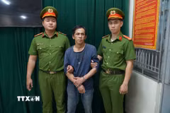 Đối tượng Trương Xuân Huy tại cơ quan công an. (Ảnh: TTXVN phát)