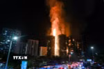 Hiện trường vụ cháy chung cư ở Hong Kong (Trung Quốc) ngày 26/11/2025. (Ảnh: THX/TTXVN)