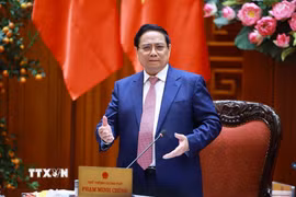 Thủ tướng Phạm Minh Chính chủ trì họp Thường trực Chính phủ về bình ổn giá xăng dầu. (Ảnh: Dương Giang/TTXVN)