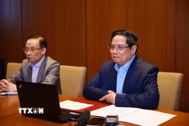 Thủ tướng Phạm Minh Chính họp trực tuyến đến các tỉnh, thành phố trong nước để triển khai các phương án cứu hộ, cứu nạn và khắc phục hậu quả thiên tai. (Ảnh: Dương Giang/TTXVN)
