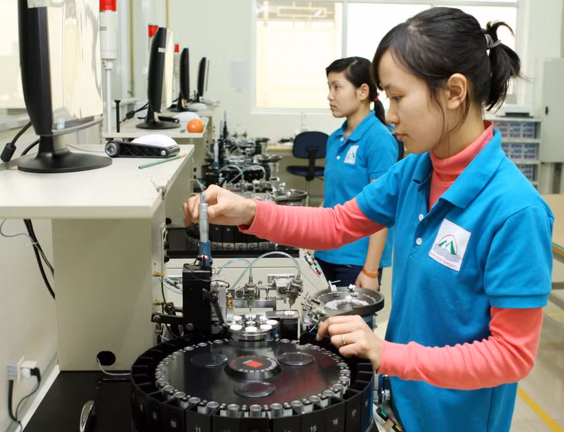 Sản xuất nhân chíp. (Ảnh: Trần Việt/TTXVN)