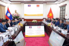 Bộ trưởng Bộ Tư pháp Hoàng Thanh Tùng hội đàm với Phó Thủ tướng, Bộ trưởng Tư pháp Lào Khamphan Phommathat. (Ảnh: Phạm Kiên/TTXVN)
