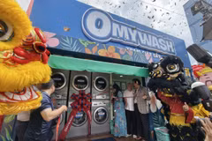 Ra mắt mô hình Trạm giặt sấy Omywash. (Ảnh: PV/Vietnam+)