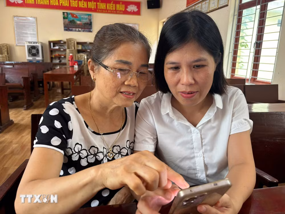 ttxvn-dang-vien-sinh-hoat-chi-bo-1-nghi-quyet-57-3.jpg
