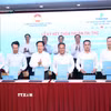 Ký Thỏa thuận tài trợ thực hiện Chương trình phục vụ cộng đồng, chăm lo người nghèo, cải thiện điều kiện sống của người dân trên địa bàn thành phố Hồ Chí Minh giai đoạn 2026-2028. (Ảnh: Xuân Khu/TTXVN)