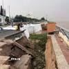 Khắc phục tạm thời điểm sạt lở, sụt lún kè Thường Thới Tiền thuộc xã Thường Phước, tỉnh Đồng Tháp. (Ảnh: TTXVN phát)
