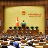 Bộ trưởng Bộ Tư pháp Hoàng Thanh Tùng trình bày Tờ trình về dự thảo Nghị quyết của Quốc hội về thí điểm chế định luật sư công. (Ảnh: Doãn Tấn/TTXVN)